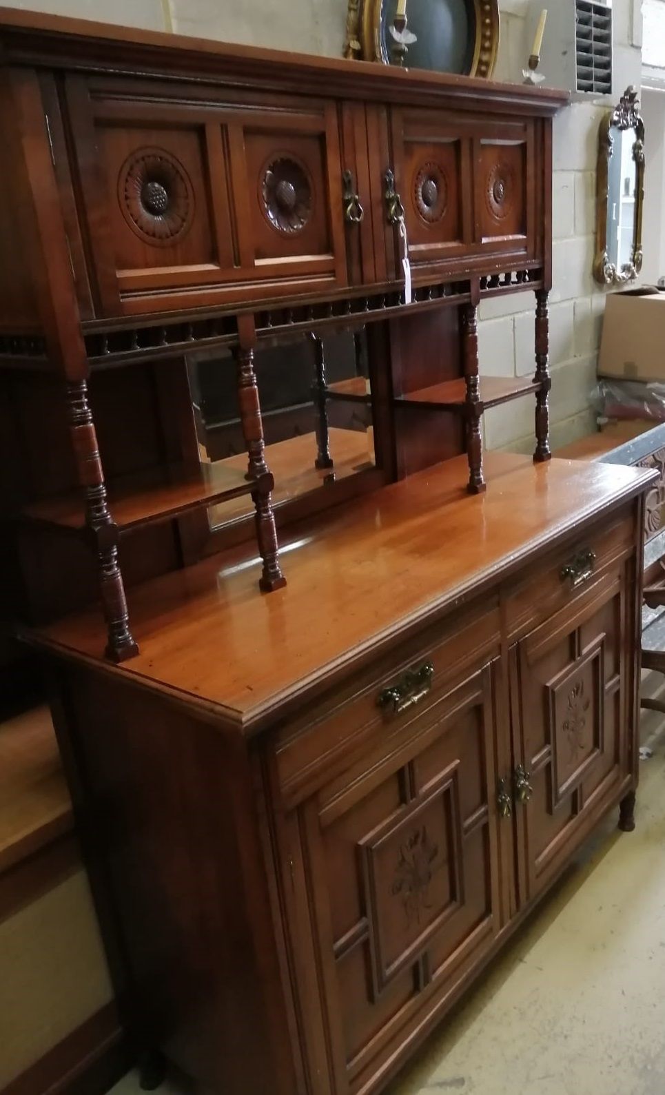 A late Victorian aesthetic movement walnut mirror back side cabinet, width 120cm, depth 51cm, height 168cm